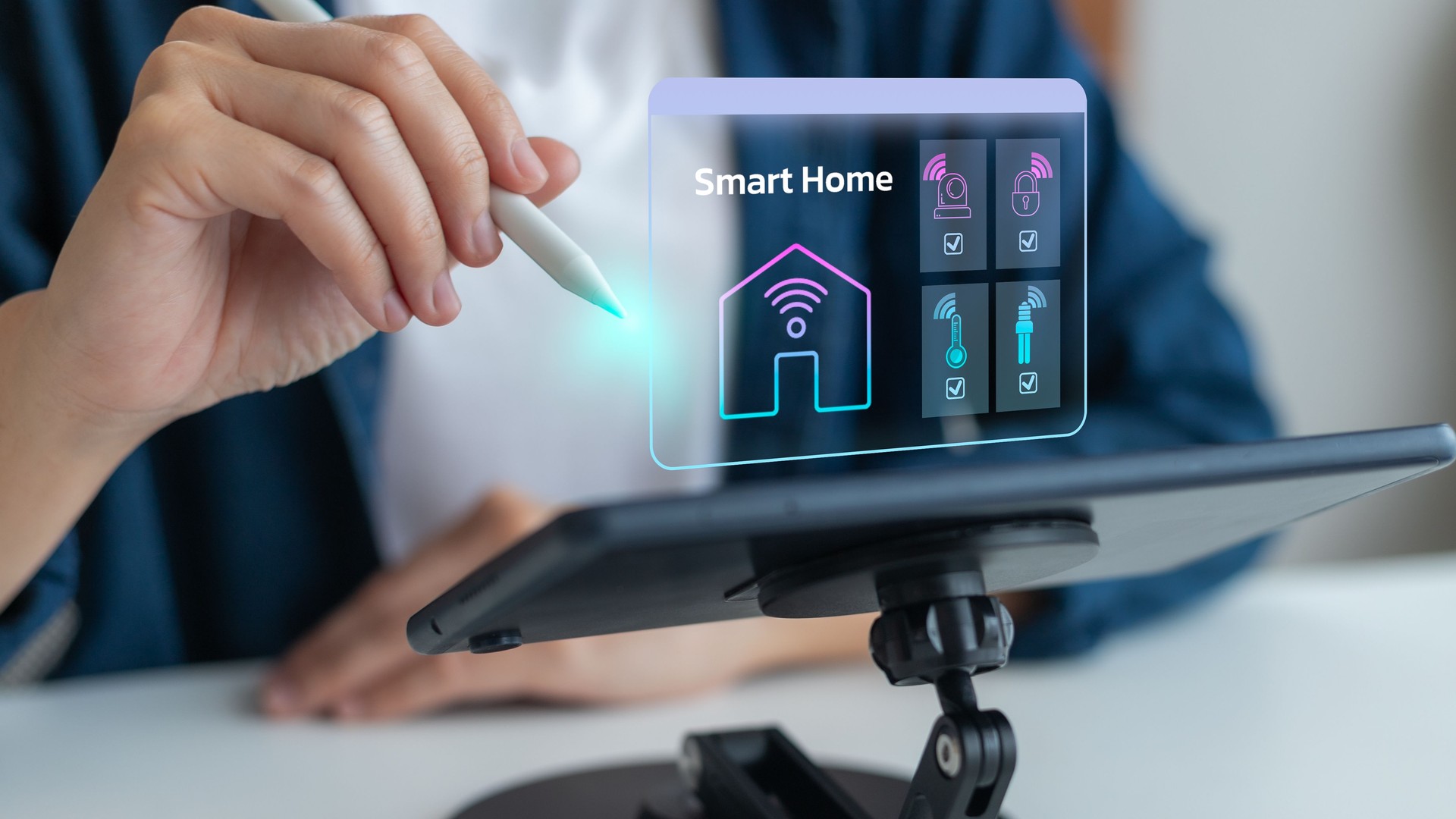 Person using tablet with smart home automation hologram, concept of IoT technology, wireless control, home security, energy management, digital lifestyle, smart devices, and modern living system.